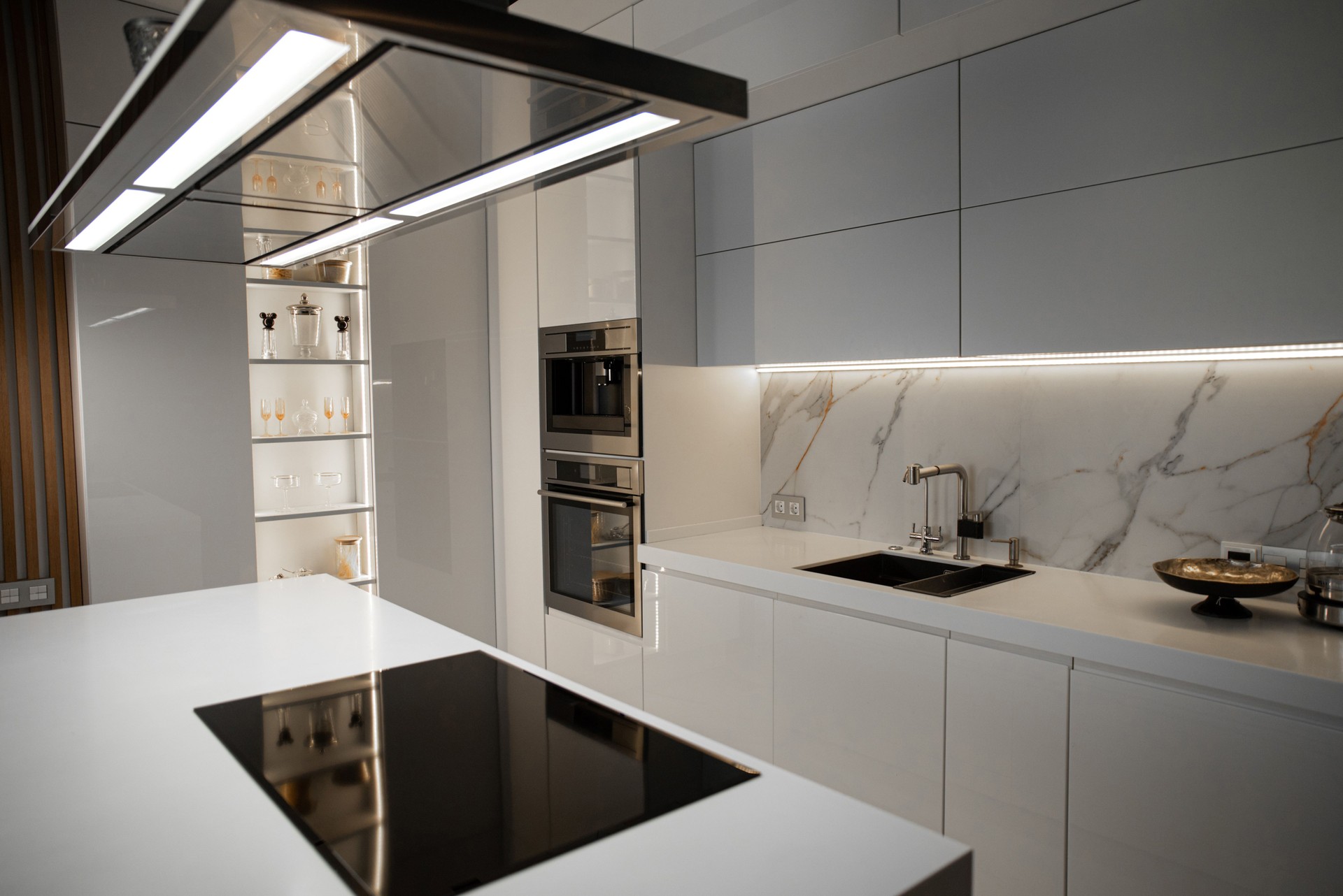 Modern white kitchen with built-in appliances